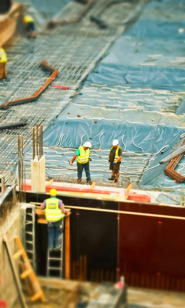 construction-site-build-construction-work-159358-159358 High-angle view of construction workers on a building site, engaging in construction work.